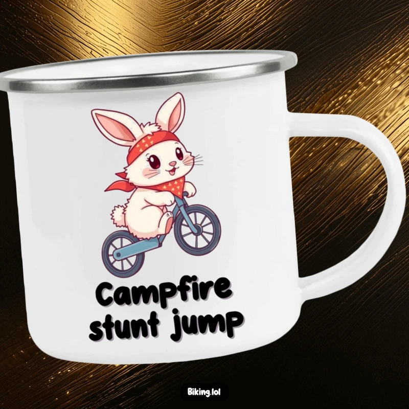 Funny bunny with a bandana flying, doing a wheelie on a bike, on a metal camping mug, for campfire tales.