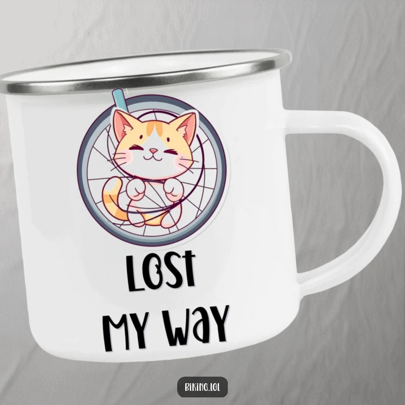 Funny camping mug featuring a cat tangled in bicycle spokes, looking bewildered but happy, bringing whimsical humor to outdoor adventures.