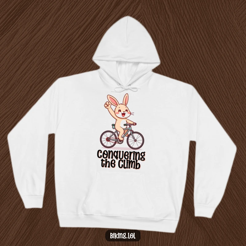 Funny hoodie with a cheerful rabbit cycling uphill, pumping its arm, soft and a perfect funny gift.