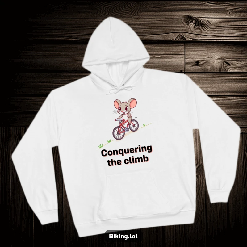 Funny mouse hoodie featuring a brave character struggling uphill on a tiny bike, capturing a moment of humorous perseverance.
