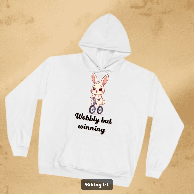 Funny bunny wearing a hoodie, wobbling on a unicycle with a determined grin, a warm and humorous funny gift.