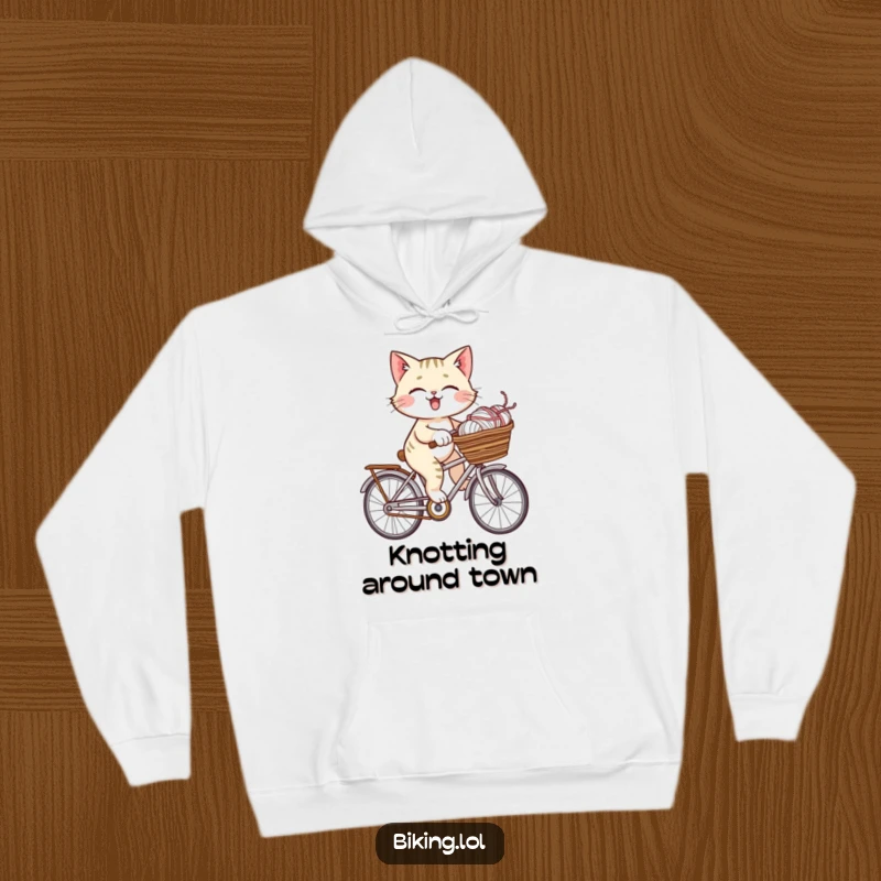 Funny giggling cat on a bicycle with a basket brimming with yarn, designed for this warm and humorous hoodie.