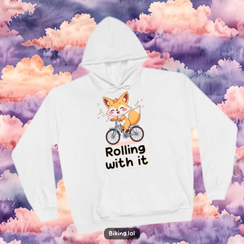 Funny hoodie featuring a cheerful fox on a bicycle with flying streamers, offering warmth and a humorous sense of adventure.