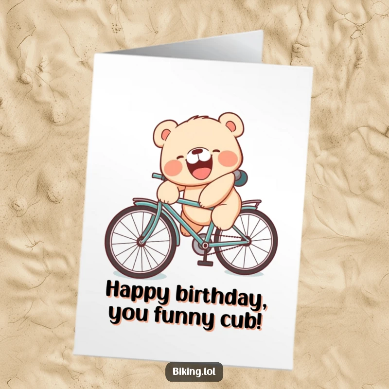 Funny Free Printable bear cub card with a laughing cub falling off a bike with a silly face for birthdays.