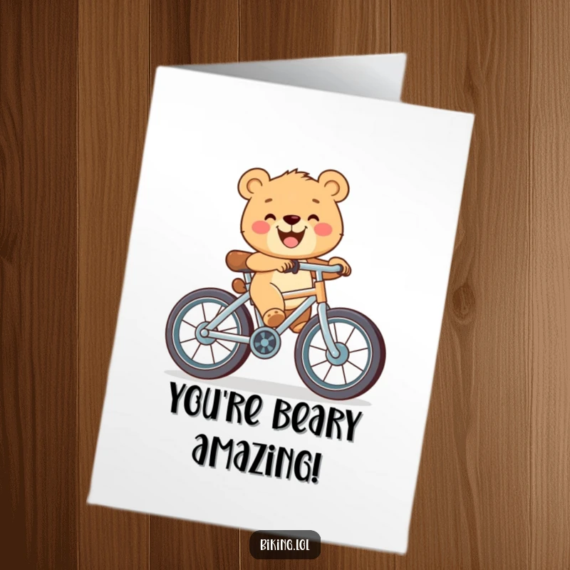 Funny Free Printable Congrats Card: Happy bear cub pedaling a bicycle with oversized wheels and a wide grin, celebrating a big achievement.