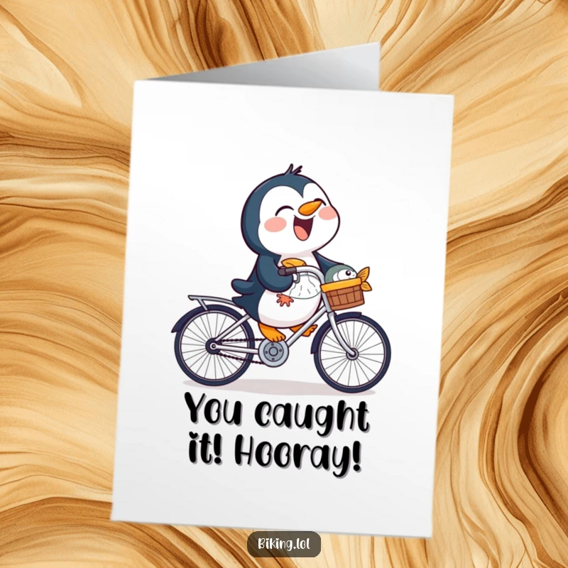 Funny Free Printable Congratulations Card featuring a happy penguin cycling with a fish in its basket, pure joy.