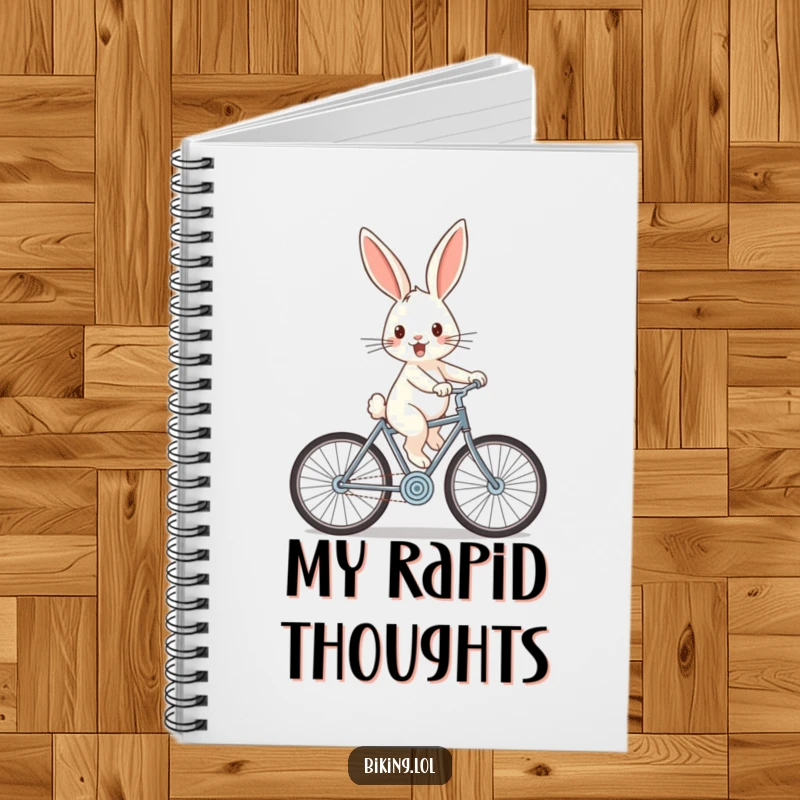 Funny rabbit notebook with a cheerful rabbit zooming downhill on a bicycle with wind-swept ears, ideal for note-taking.