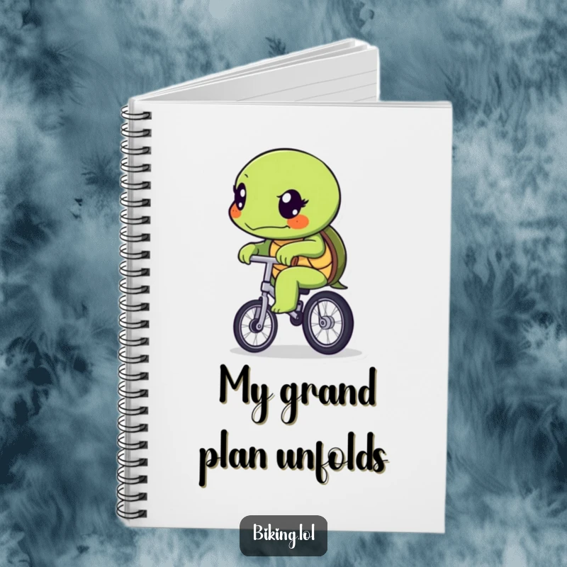 Funny determined turtle character slowly pedaling a unicycle, featured on the cover of a humorous notebook.