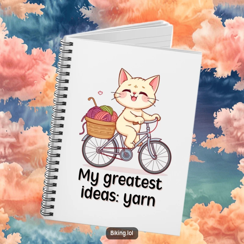 Funny notebook cover with a giggling cat riding a bicycle, its basket packed with yarn, inspiring creative writing and playful ideas.
