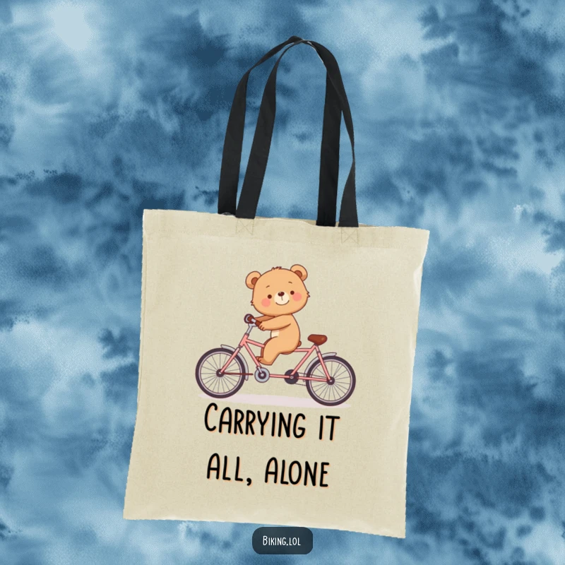 Funny tote bag with a smiling bear cub struggling to ride a tandem bicycle alone.