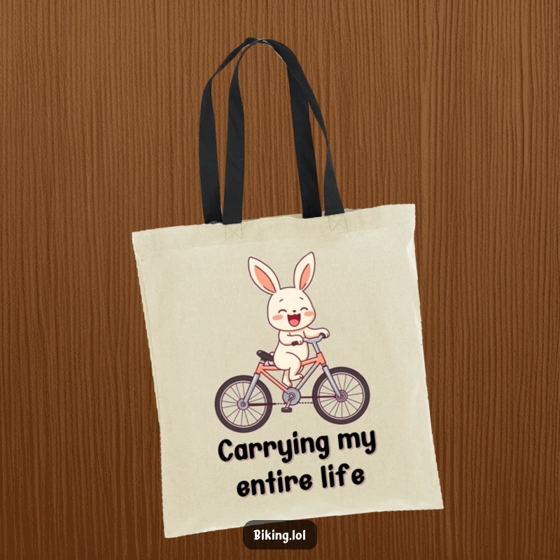 Funny bunny performing a hilarious wheelie on a tiny bicycle, captured laughing out loud on a durable tote bag.