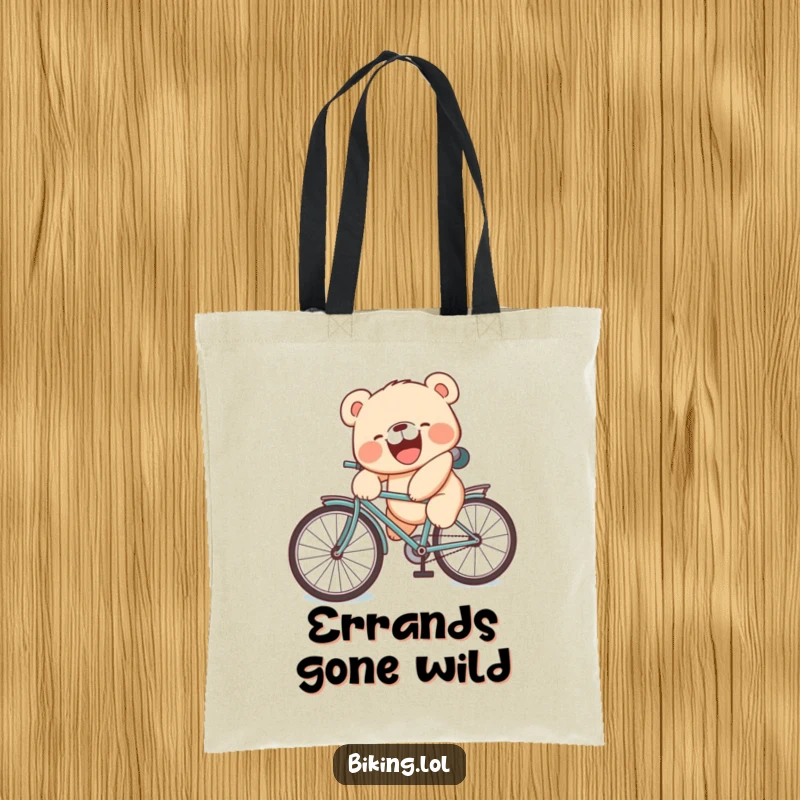Funny tote bag featuring a laughing bear cub with a silly face tumbling off a bicycle seat.