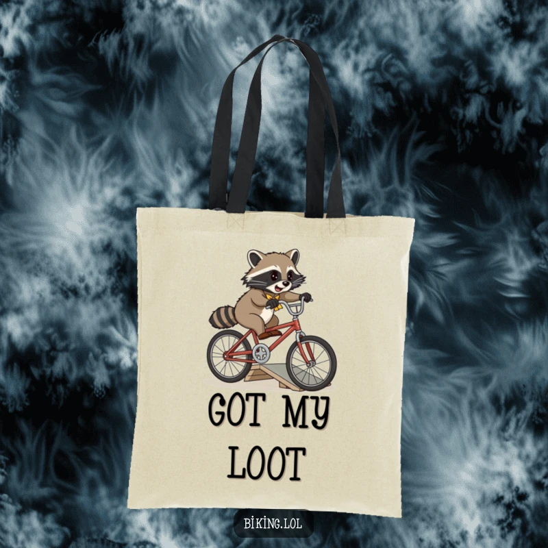 Funny playful raccoon attempting a jump over a small ramp on a vintage bicycle on a durable tote bag.